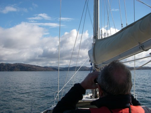 Tony with the binoculars as we look for the entrance to Loch Moidart