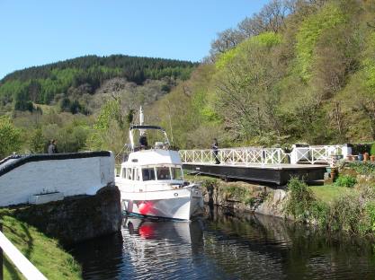 Lock opens for a motor cruiser on the Crinan Canal
