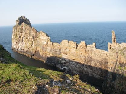 The saw-tooth cliff leading out to sea from the last redoubt of the Iron age fortress.