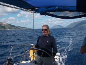 Chris at the helm in Turkish waters, where we found very large chart errors.