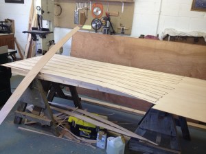 Cutting planks from a plywood sheet.