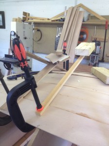 Clamp, wooden lever and weight to move the pressure over the glued joint.