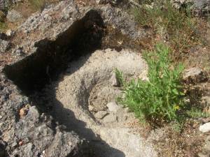 A basin of some sort carved into the rock.