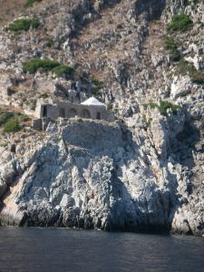 A monastery perched near the point of the cape.