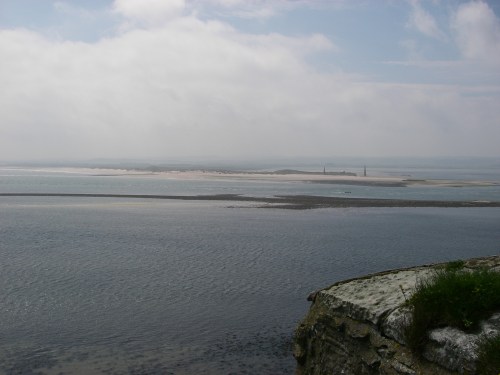 The entrance channel to the anchorage near low tide, with the leading marks in the distance.